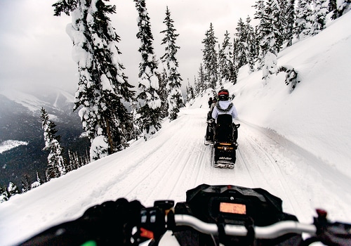 How to Handle Rough Terrain During a Snowmobile Race