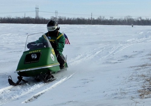 How to Handle Jumps and Obstacles in Snowmobiling Races